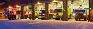 Fire trucks at fire station at night