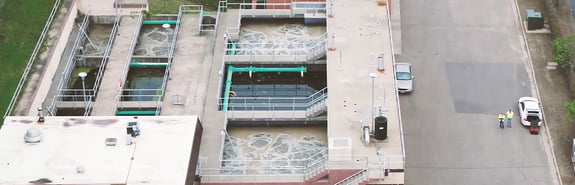Overhead view of wastewater treatment holding pools and facility