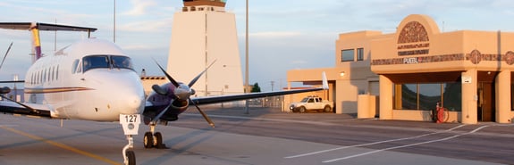 Small two prop airplane on runway